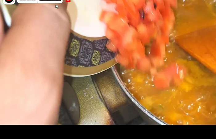 Add tomatoes last to maintain their shape and color.