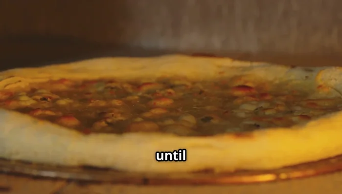 Carefully slide pizza onto the hot stone. Bake for 8-10 minutes, until crust is golden and cheese is bubbly and slightly brown.