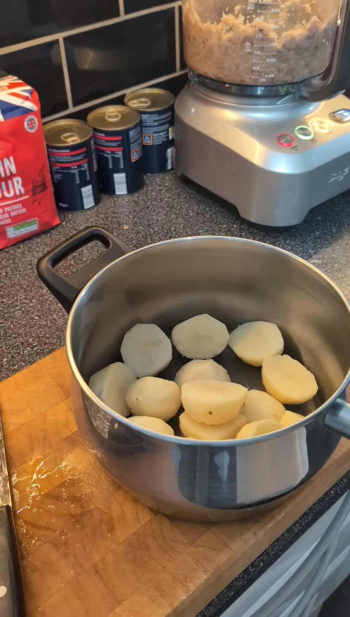 Peel and cut potatoes into chunks. Boil in a pan with plenty of salt until just tender, not mushy.