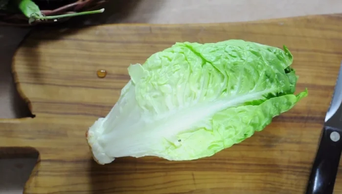 Prepare all vegetables. Set aside four large lettuce leaves.