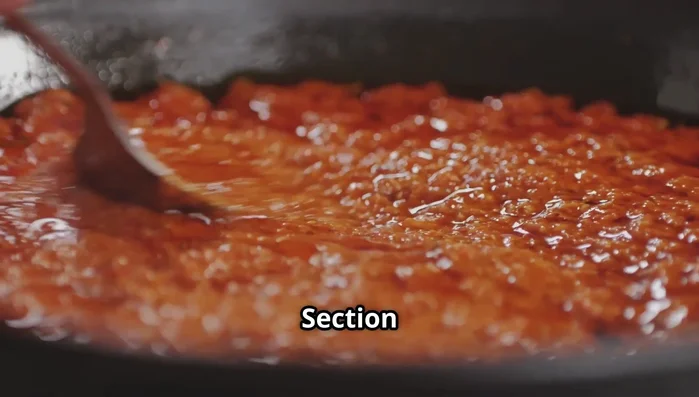 Taste and adjust seasoning: Add a pinch of sugar to balance acidity, red wine vinegar for tang, and salt and pepper to taste.