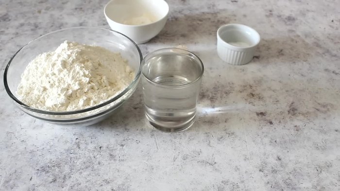 Prepare the dough: In a glass, dissolve yeast and sugar in warm water. Mix.