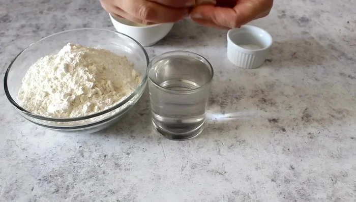 Combine flour and water mixture, knead until a smooth dough forms. Add salt and continue kneading.