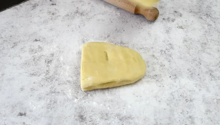 Roll out two-thirds of the shortcrust pastry and line a greased and floured 24cm tart pan.