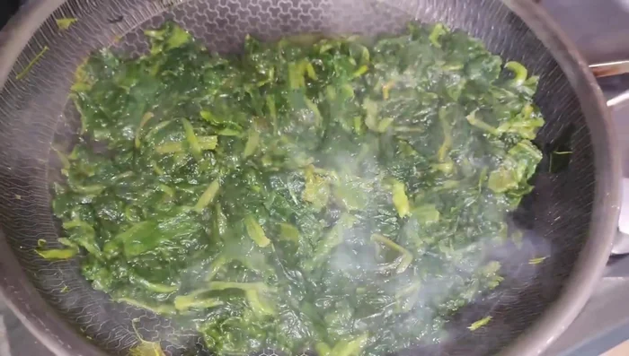 Cook the spinach until it wilts. Season with salt and pepper to taste.