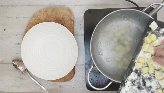 Bring a large pot of salted water to a rolling boil. Cook gnocchi in small batches until they float to the top.