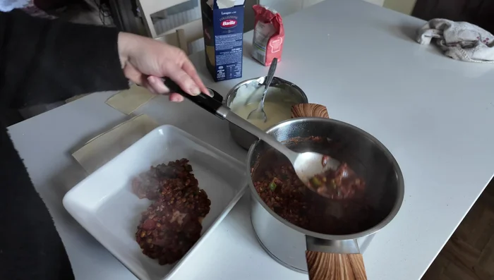 Layer the lasagna: Spread a layer of the mushroom and lentil mixture in a baking dish, then add a layer of pasta sheets, followed by a layer of cheese sauce. Repeat layers, ending with cheese sauce on top. Sprinkle with extra grated cheese.