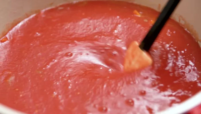 Reduce heat and simmer until the sauce reduces to about 2/3 of its original volume, stirring occasionally to prevent burning.