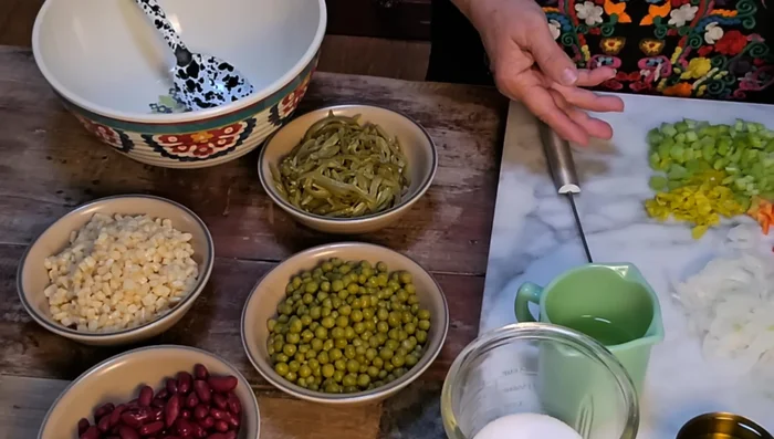 Combine all beans, celery, bell pepper, onion, and pepperoncini peppers in a large bowl.