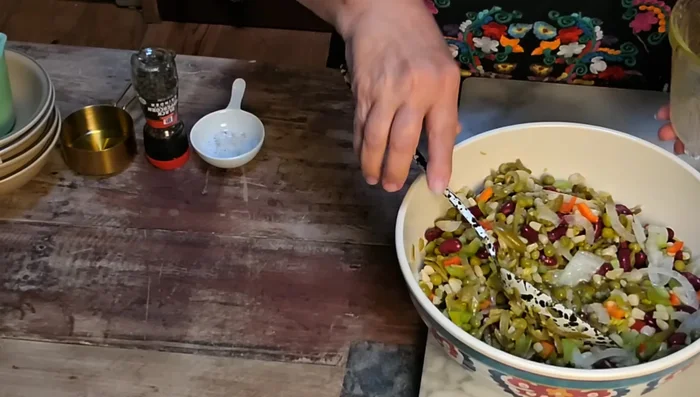 Pour the vinaigrette over the bean mixture and toss to combine. Cover and refrigerate for at least a few hours, or up to a week.