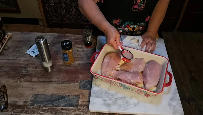 Pour lemon juice over each chicken breast. Sprinkle with Italian dressing mix and rosemary and garlic seasoning.