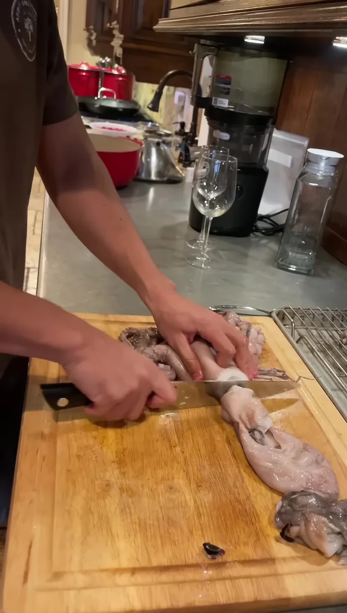 Bring a large pot of water to a boil. Dip the octopus in and out three times to shock it (this helps curl the tentacles). Submerge it for 2-3 minutes.