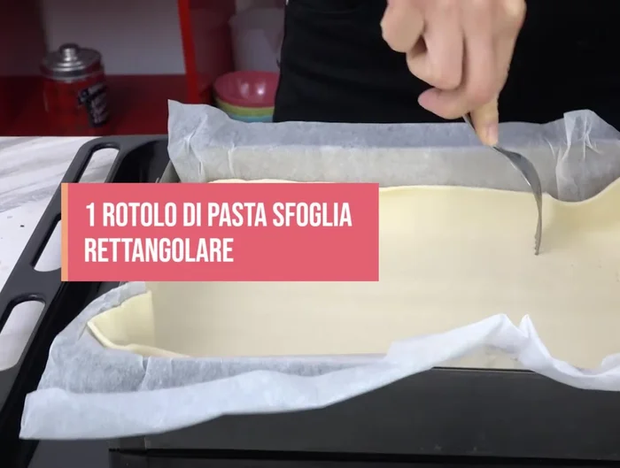 Roll out one sheet of puff pastry and prick it with a fork.