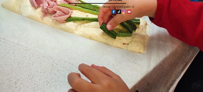 Add the remaining toppings, such as more ham or other vegetables, to resemble a garden scene.