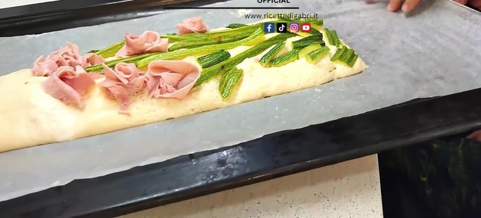 Place the pizza in a baking pan.