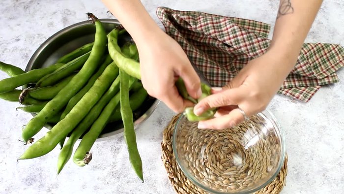 Peel 750g of broad beans.