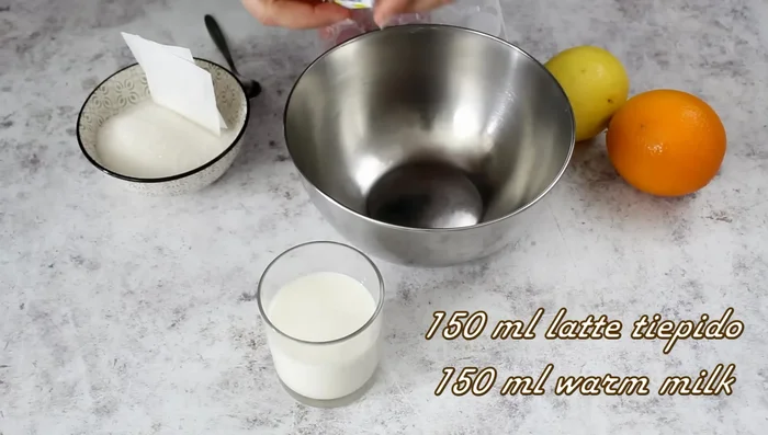 Dissolve yeast in warm milk with a teaspoon of sugar.