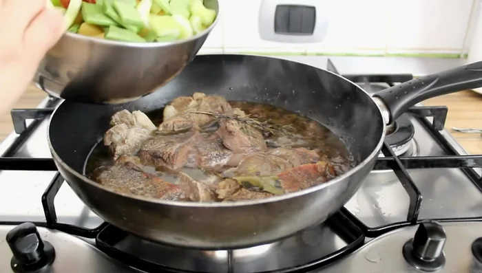 Add the prepared vegetables to the stew.