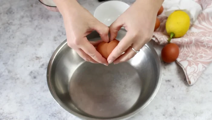 Prepare zeppole dough: Whisk eggs, sugar, lemon zest until light and frothy. Add oil and Alkermes, mix well. Gradually add flour and baking powder.