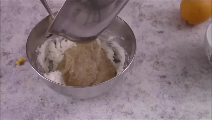 Mix ricotta, cooled wheat, eggs, orange blossom water, lemon zest, and cinnamon.