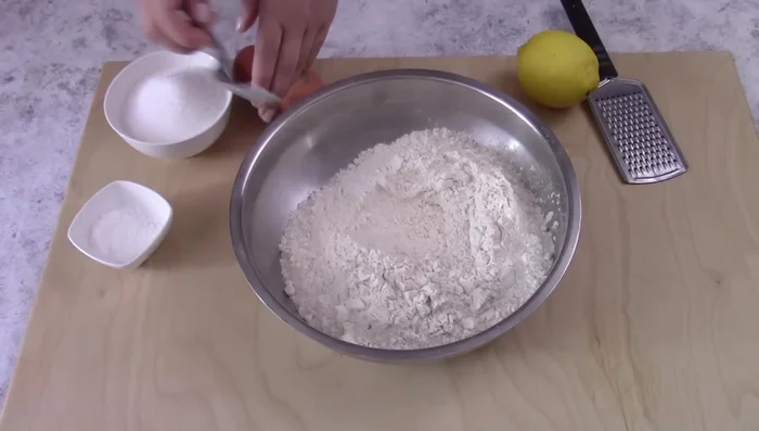Prepare scarcelle dough: Mix flour, sugar, lemon zest, salt, baking powder, eggs, oil, and milk until smooth. Let rest for 30 minutes.