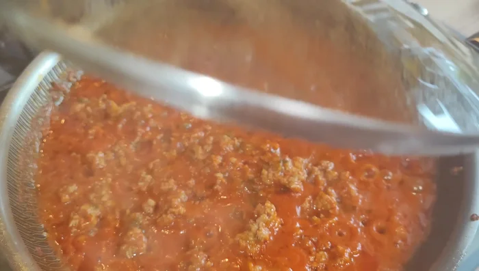 Top with mozzarella and Parmesan cheese. Sprinkle with breadcrumbs.