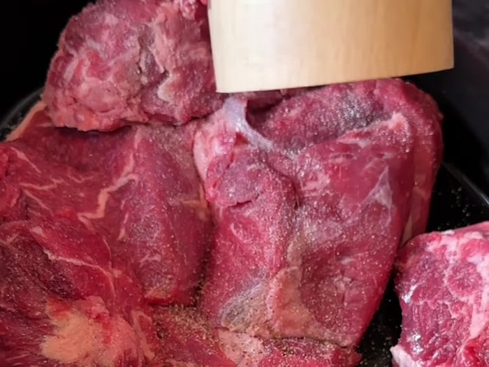 Season the chuck roast with salt and pepper.