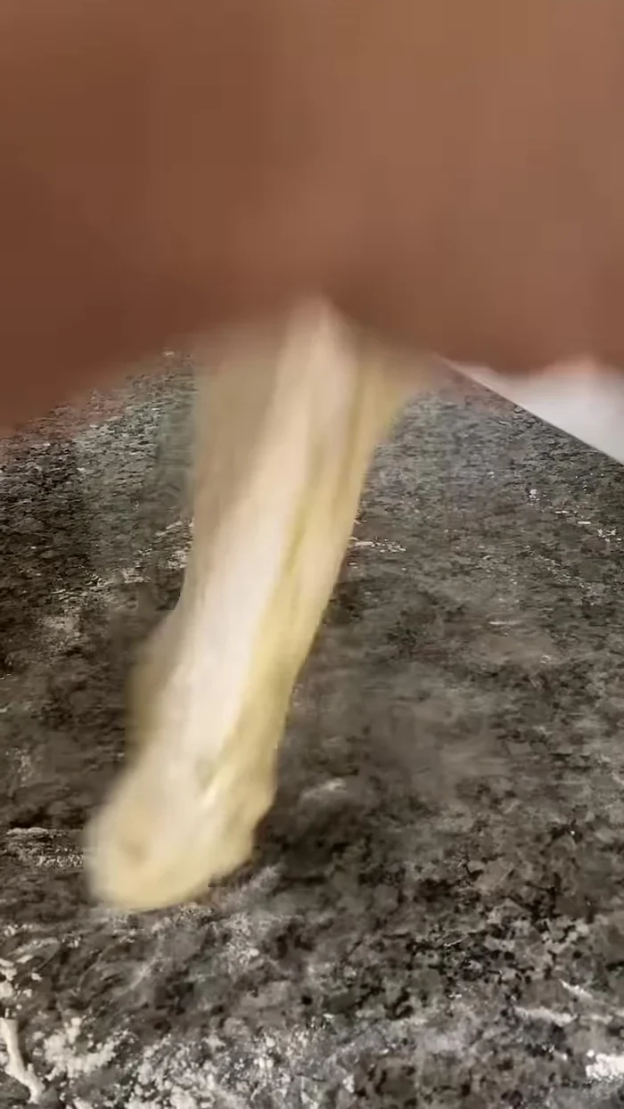 Roll out the dough into a rectangle, about the thickness of a fat finger.