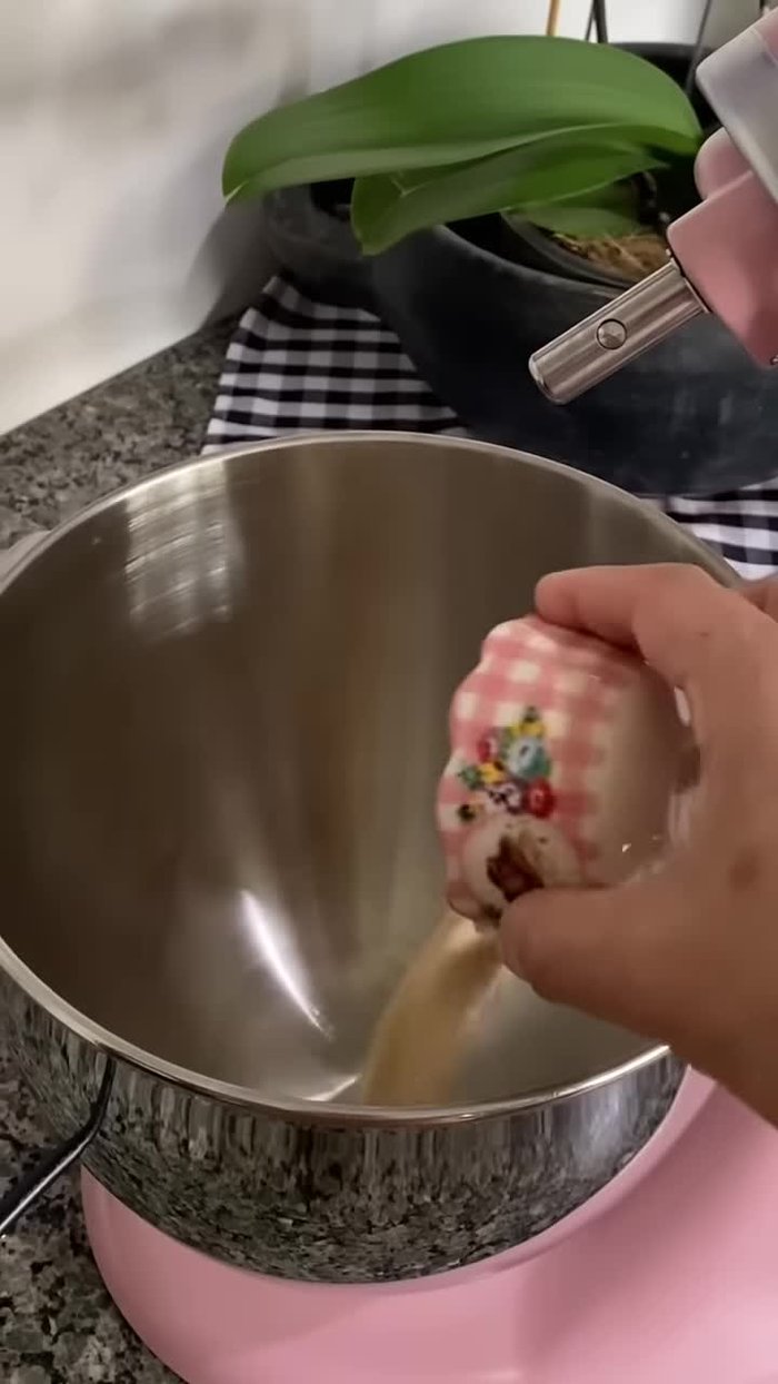 Place yeast, sugar, and warm water in a bowl.