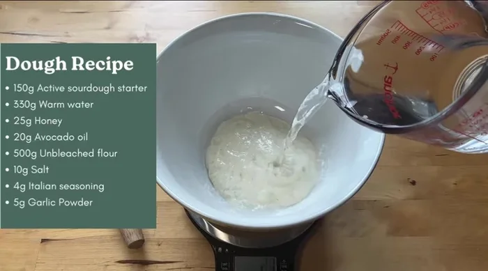 In a bowl, combine 330g warm water (80-90°), 25g honey, and 20g avocado oil.