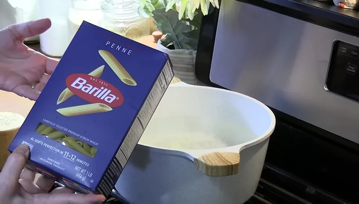Add penne pasta and stir for 30 seconds to prevent sticking. Cook according to package directions until al dente.