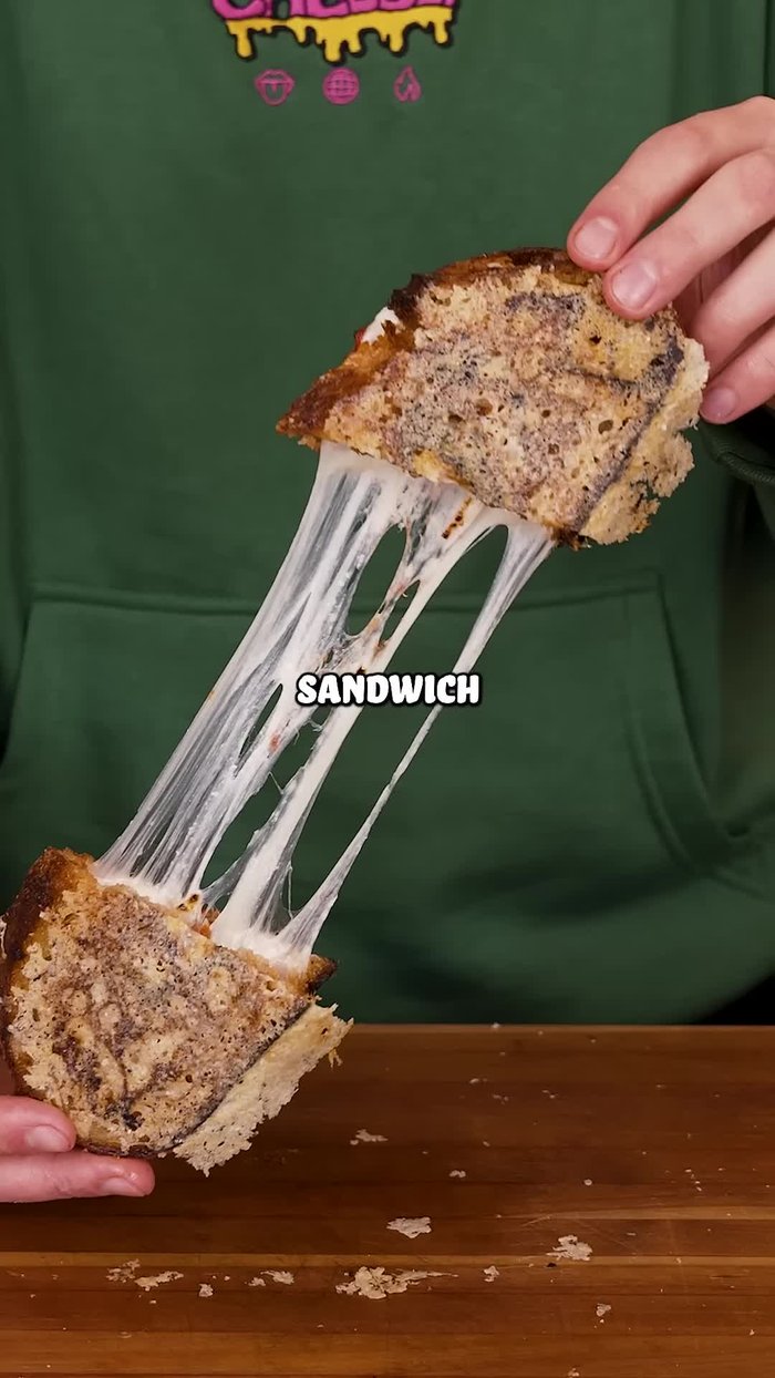 Spread a generous layer of Bolognese sauce onto one slice of bread.