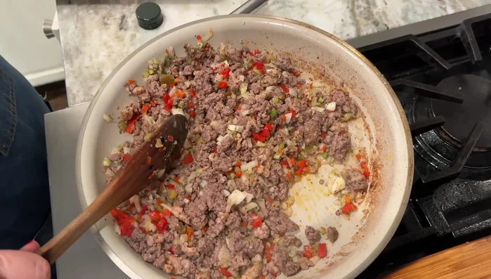 Stir in garlic powder, oregano, basil, salt, pepper, and Chicago style giardiniera.