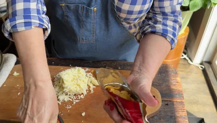 Open your taco bag/shell. You can use Fritos, other corn chips, or potato chips.