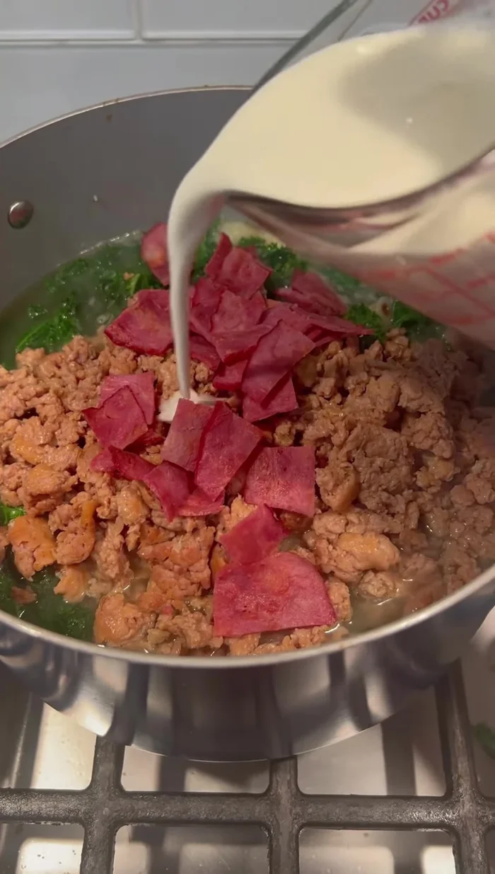 Add heavy whipping cream to the soup.