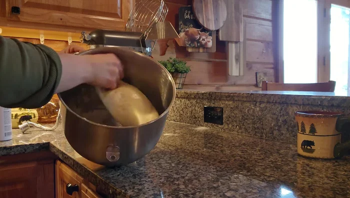 Lightly coat the dough ball with cooking spray.