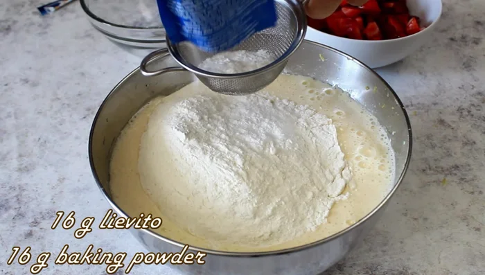 Add 280g flour and 1 sachet of baking powder. Mix.