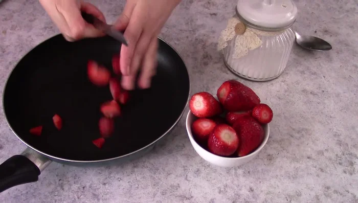Prepare strawberries: Cut strawberries into small pieces. Cook with sugar and water until sugar melts and caramelizes (2-3 minutes). Strain to separate juice from strawberries.