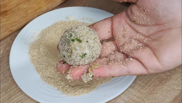 Serve the eggplant meatballs with tomato sauce. (Sauce preparation not specified)