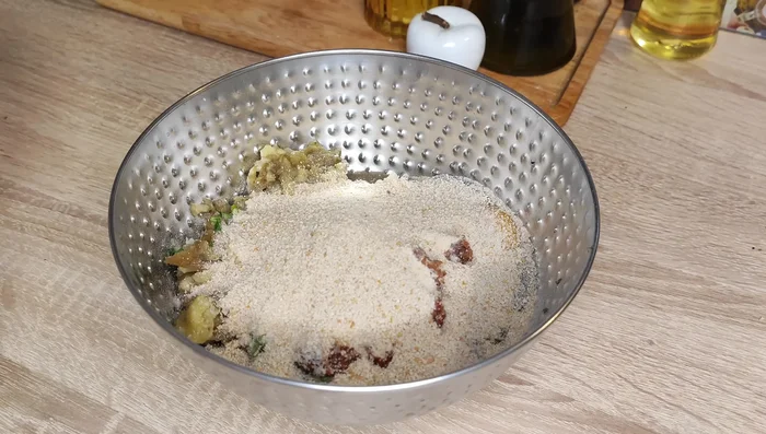 Bake the meatballs in the oven. (Temperature, time, and baking sheet preparation not specified)