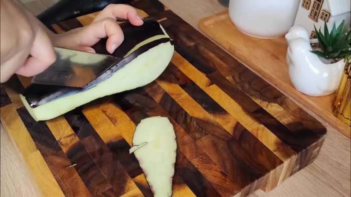 Start preparing the eggplant. (Specific steps are missing from the transcript)