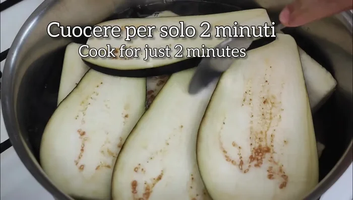 Add the eggplant slices to the pan and cook until golden brown and slightly tender.