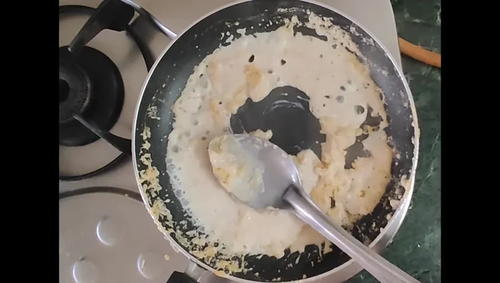 Gradually add milk, stirring constantly to prevent lumps, until the sauce thickens.