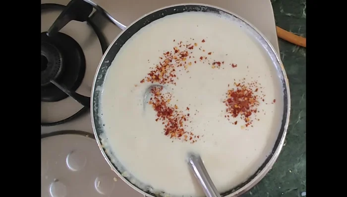 Stir in cheese (optional), chili flakes, and oregano.