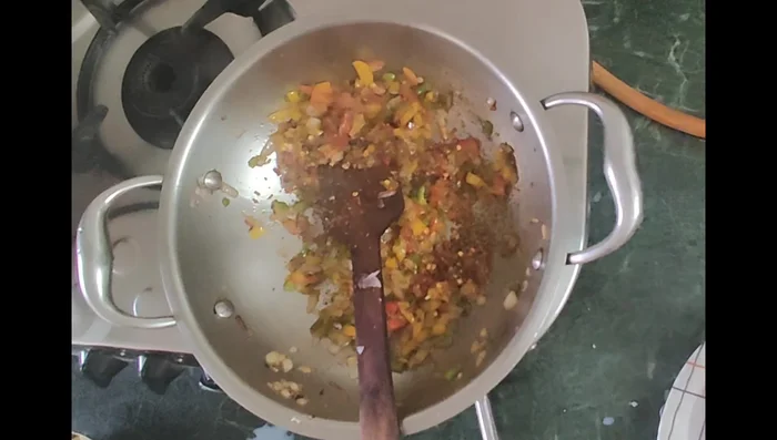 Add chili flakes, oregano, and salt to taste. Fry further.