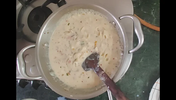 Add the cooked pasta to the sauce. Mix well. Add more cheese if desired.
