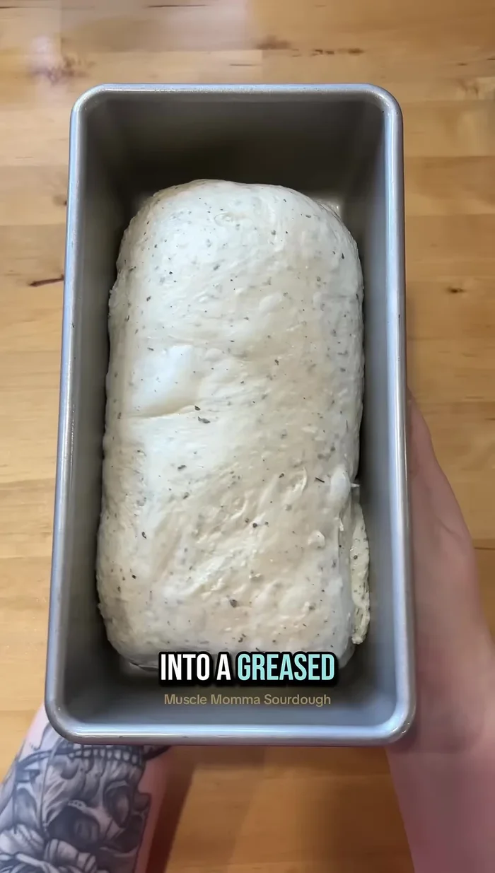 Let the dough proof until it fills the pan. Top with the remaining cheese.