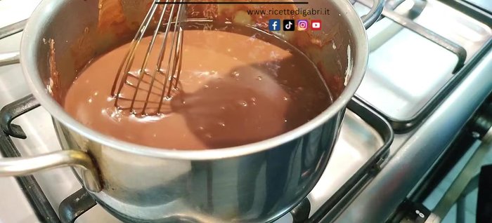 Slowly add the eggs one at a time, mixing continuously to prevent curdling. Maintain very low heat.