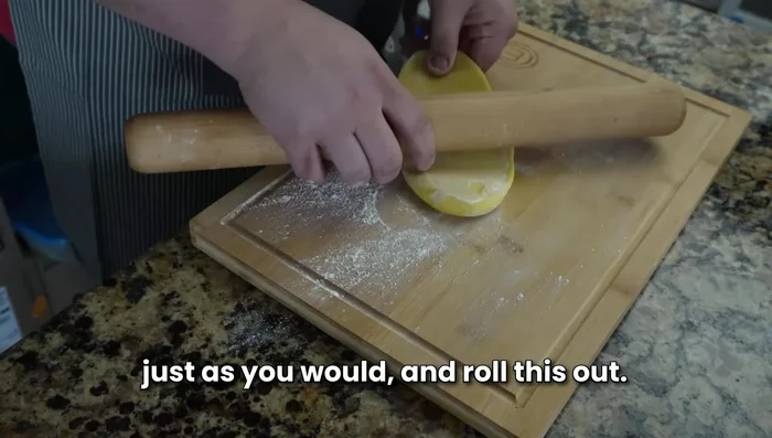 Lightly dust your work surface with flour. Roll out the dough thinly using a rolling pin, until translucent.