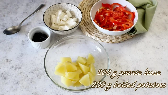 Combine 200g boiled potatoes with 150g raw or cooked peppers, 80g feta cheese, and 20g olives.